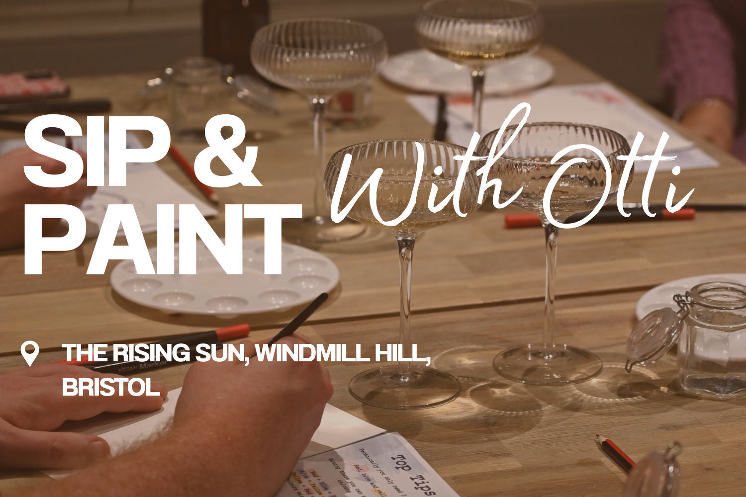 A table set with wine glasses, a palette, and paper for a painting or sip and paint event at The Rising Sun, Windmill Hill, Bristol.