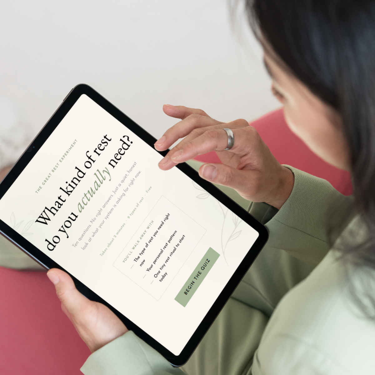 Person holding a tablet with a quiz about rest titled 'What kind of rest do you actually need?'