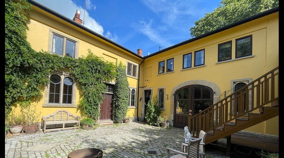 The ivy-covered courtyard of Sambogaya, a boutique retreat house in Glastonbury