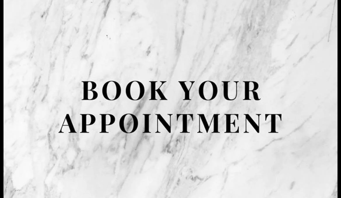 Text on a white marble background that reads, "Book Your Appointment."