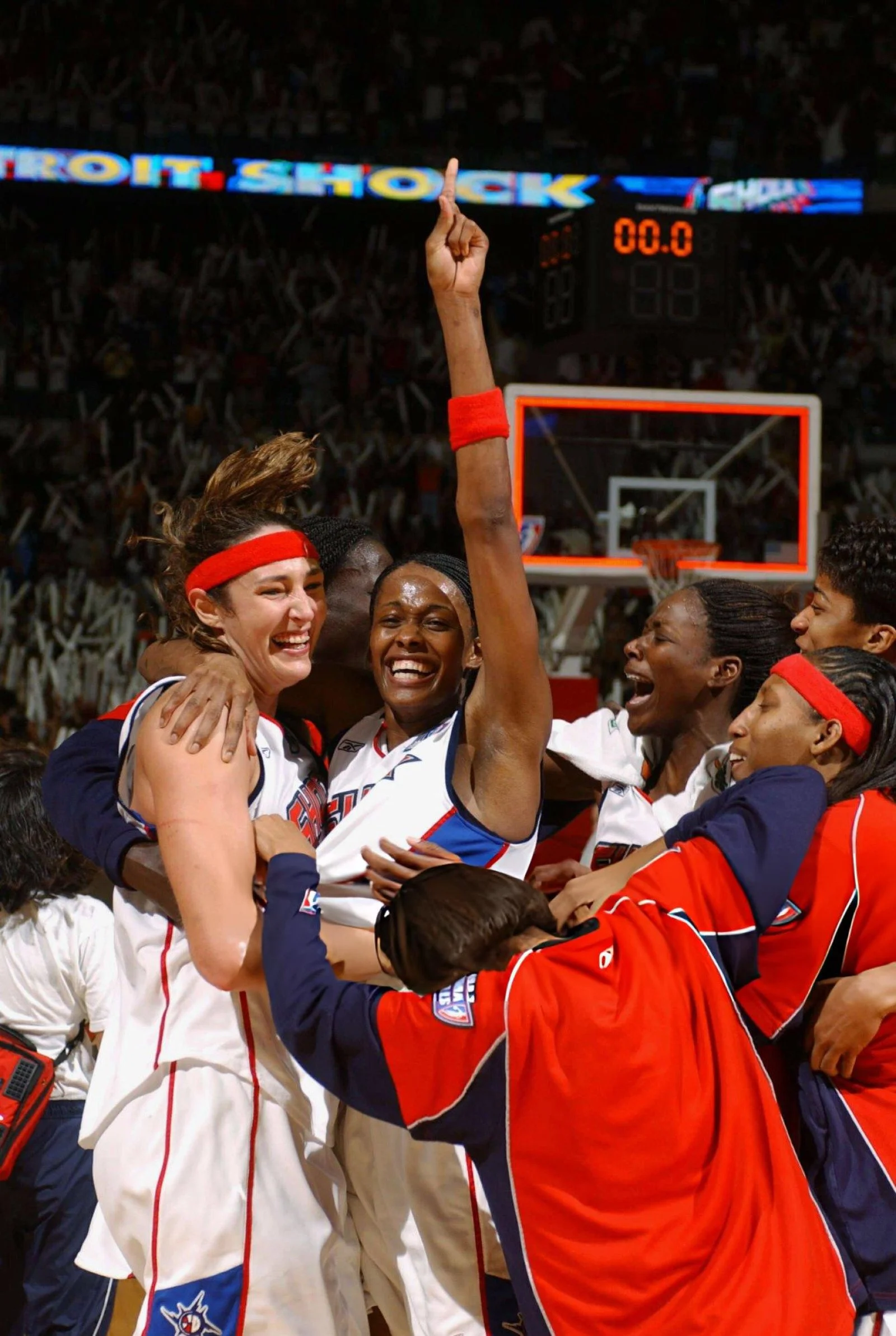 Detroit Shock players celebrating immediately after a championship victory.