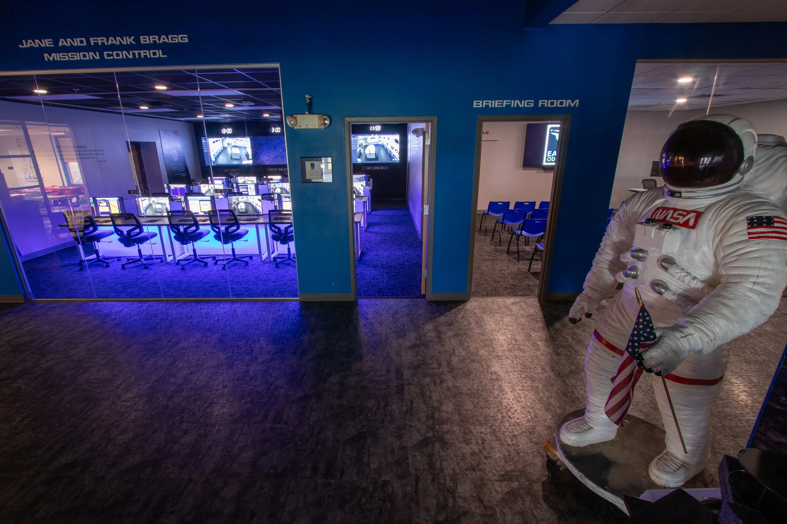 Inside of Challenger Maine lobby with open doorways and astronaut statue to the right