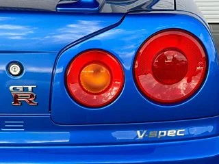 2000 Nissan Skyline GT-R BNR34 in blue, imported from Chiba Japan — rare JDM turbo 4WD coupe with 13,000 km.