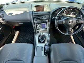 2000 Nissan Skyline GT-R BNR34 in blue, imported from Chiba Japan — rare JDM turbo 4WD coupe with 13,000 km.