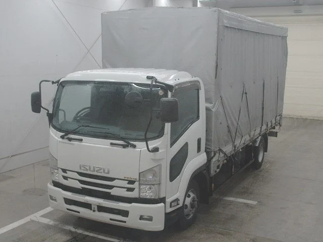 White Isuzu box truck with gray tarp cover, parked in an indoor garage