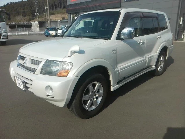 White SUV parked in a lot.