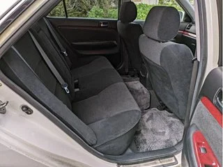 Classic JDM car exterior with clean body lines and factory aero kit