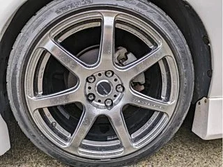 Classic JDM car exterior with clean body lines and factory aero kit