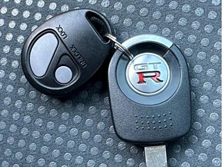 2000 Nissan Skyline GT-R BNR34 in blue, imported from Chiba Japan — rare JDM turbo 4WD coupe with 13,000 km.