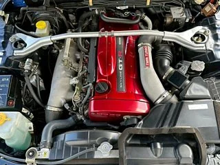 2000 Nissan Skyline GT-R BNR34 in blue, imported from Chiba Japan — rare JDM turbo 4WD coupe with 13,000 km.