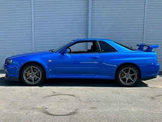 2000 Nissan Skyline GT-R BNR34 in blue, imported from Chiba Japan — rare JDM turbo 4WD coupe with 13,000 km.