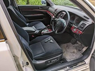 Classic JDM car exterior with clean body lines and factory aero kit