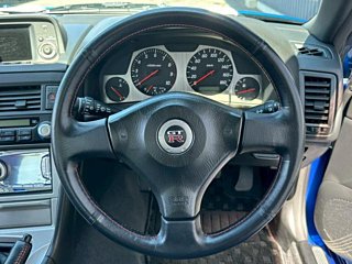 2000 Nissan Skyline GT-R BNR34 in blue, imported from Chiba Japan — rare JDM turbo 4WD coupe with 13,000 km.