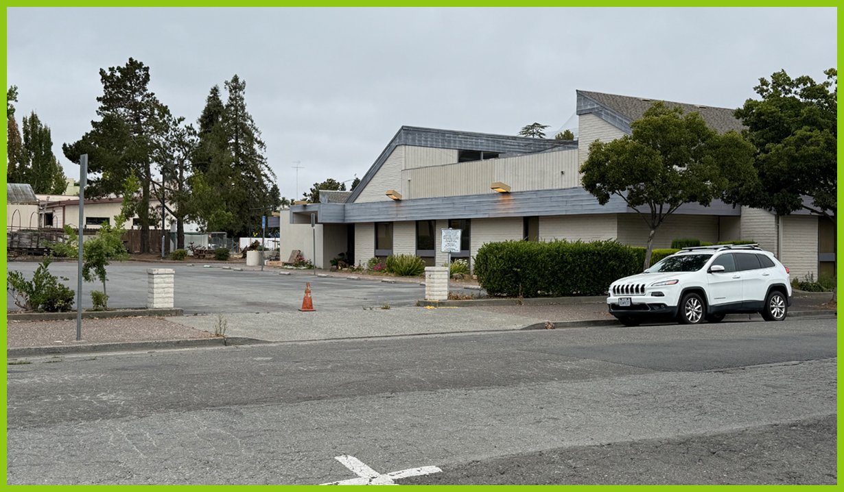  Ahead are more businesses, but even the bank we spot is vacant. 