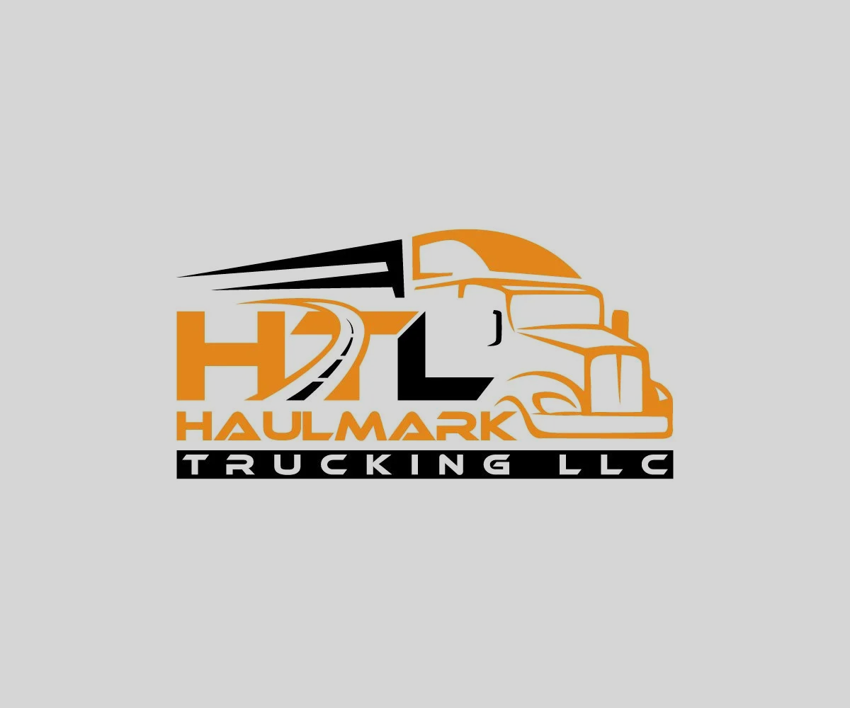 Logo for Haulmark Trucking LLC, featuring a stylized truck in black and orange with a road leading towards the horizon