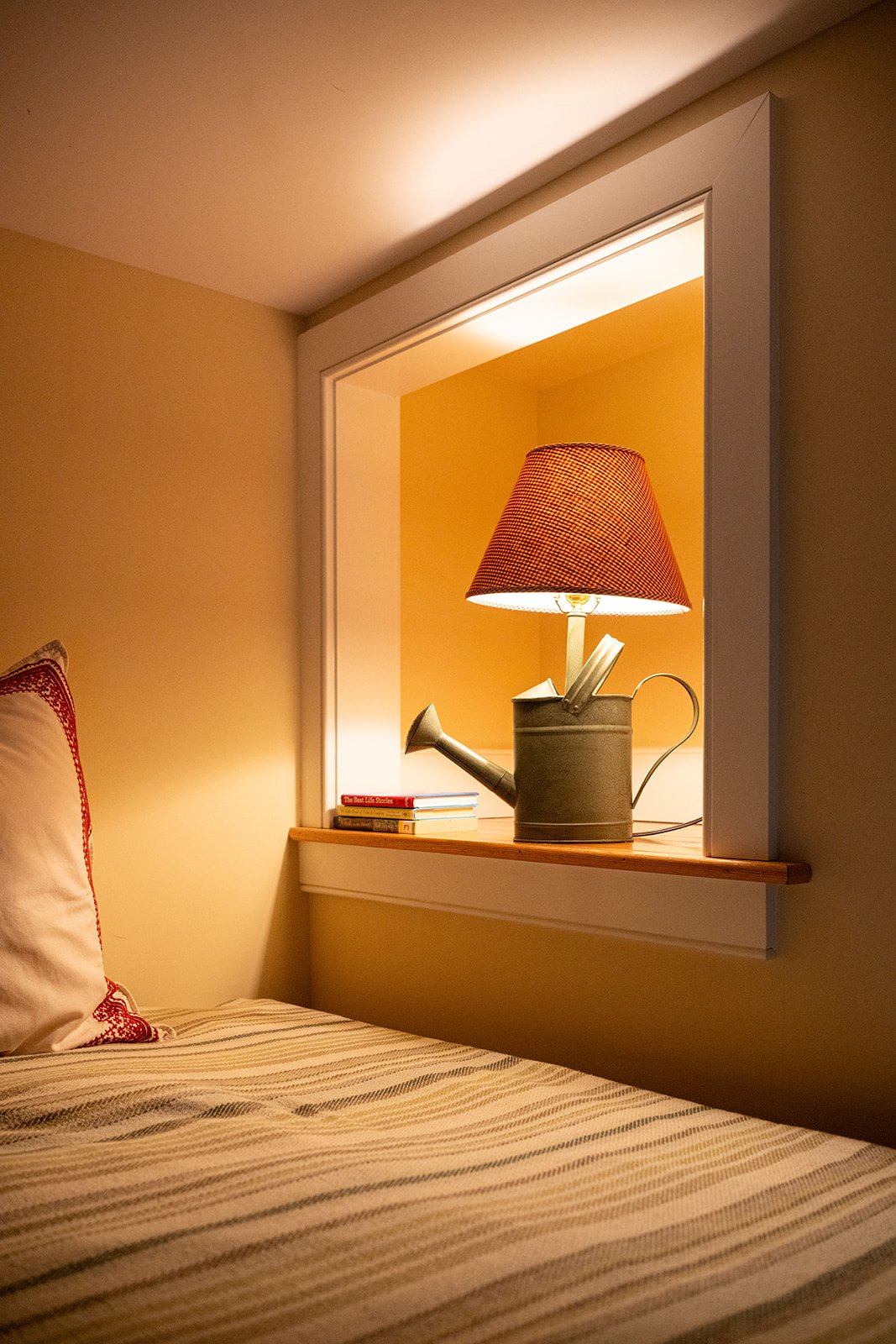 Cozy reading nook in Zoe's loft featuring warm lighting, decorative accents and intimate loft atmosphere