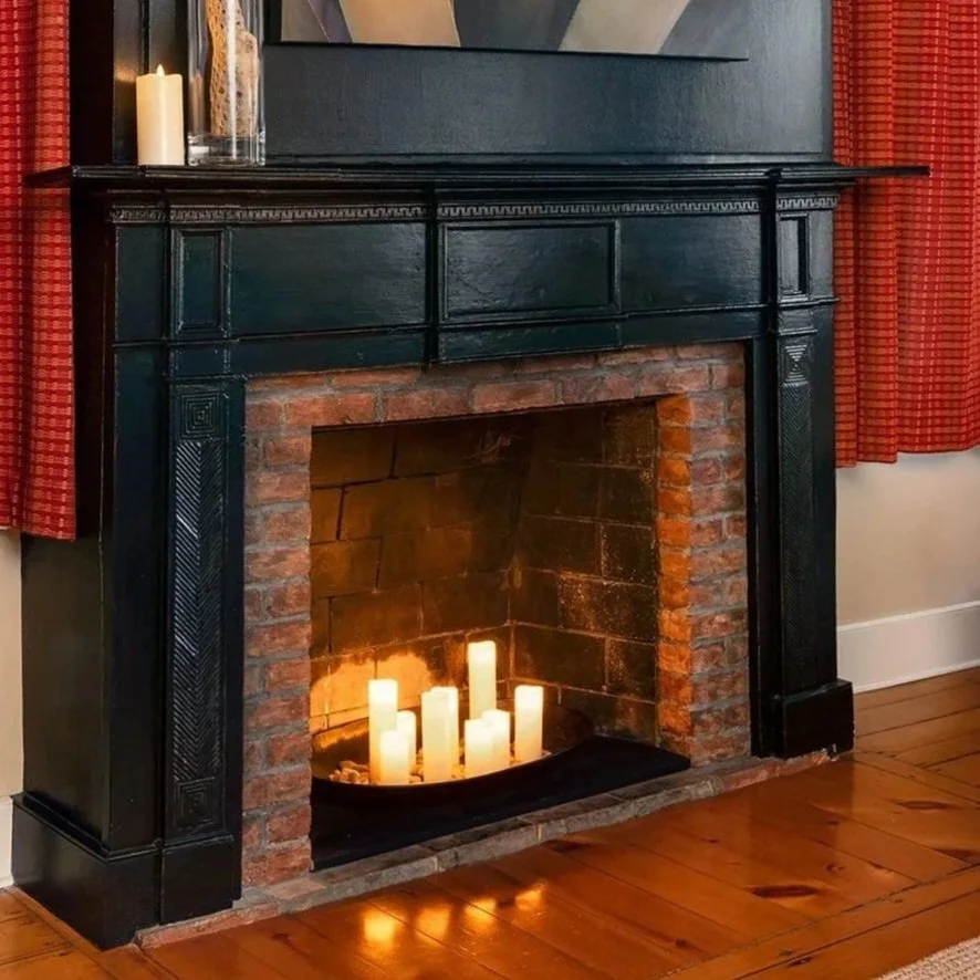 Original historic fireplace hearth in The Lounge at Butler House adding charm and character