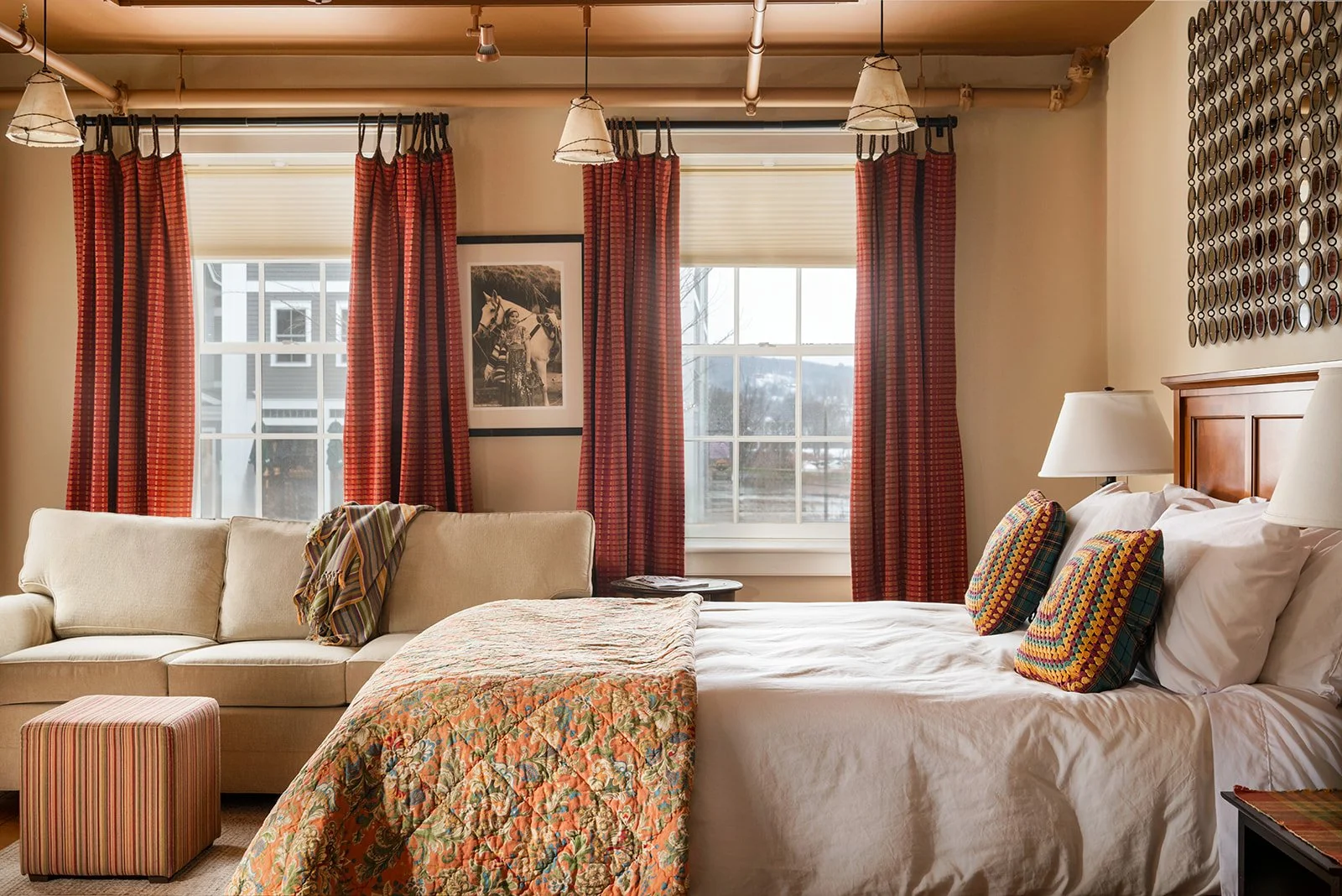 The Lounge ground-floor suite in Stowe Village with large bed, soft lighting and village facing windows