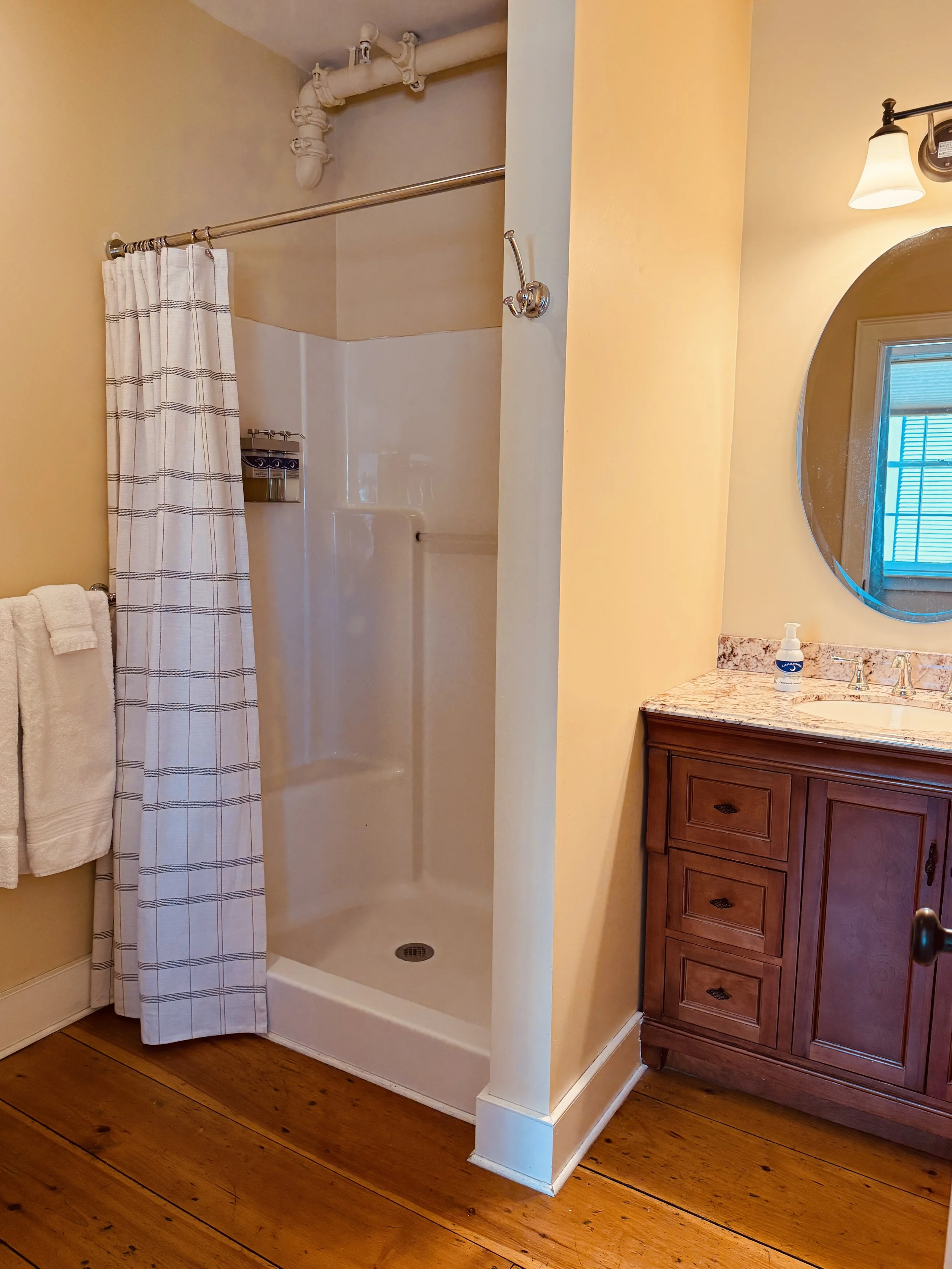 Bathroom in Parlor Suite with shower, vanity, and clean comfortable design