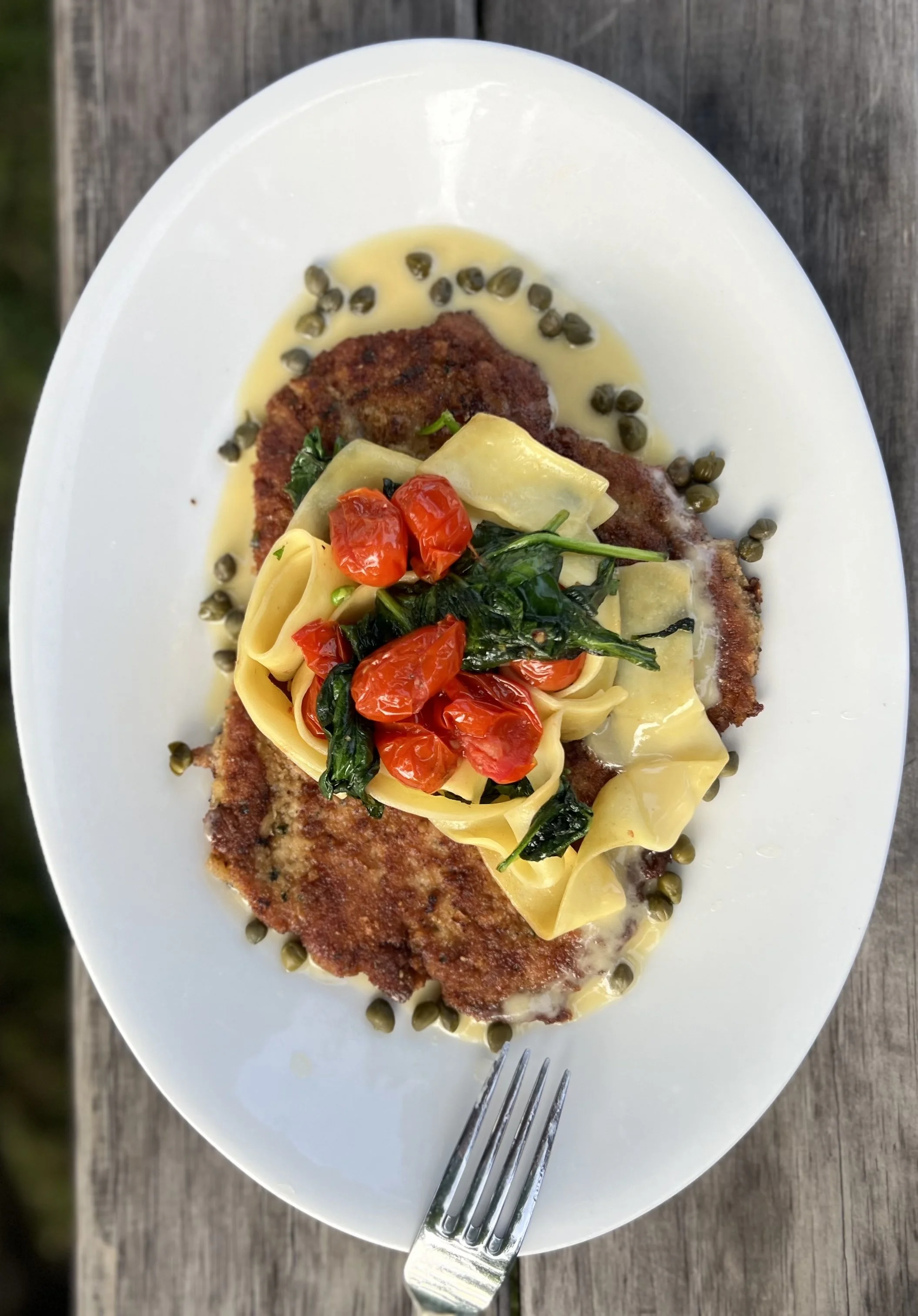 Dinner entree at Butler's Pantry in Stowe Vermont with pasta, greens and schnitzel