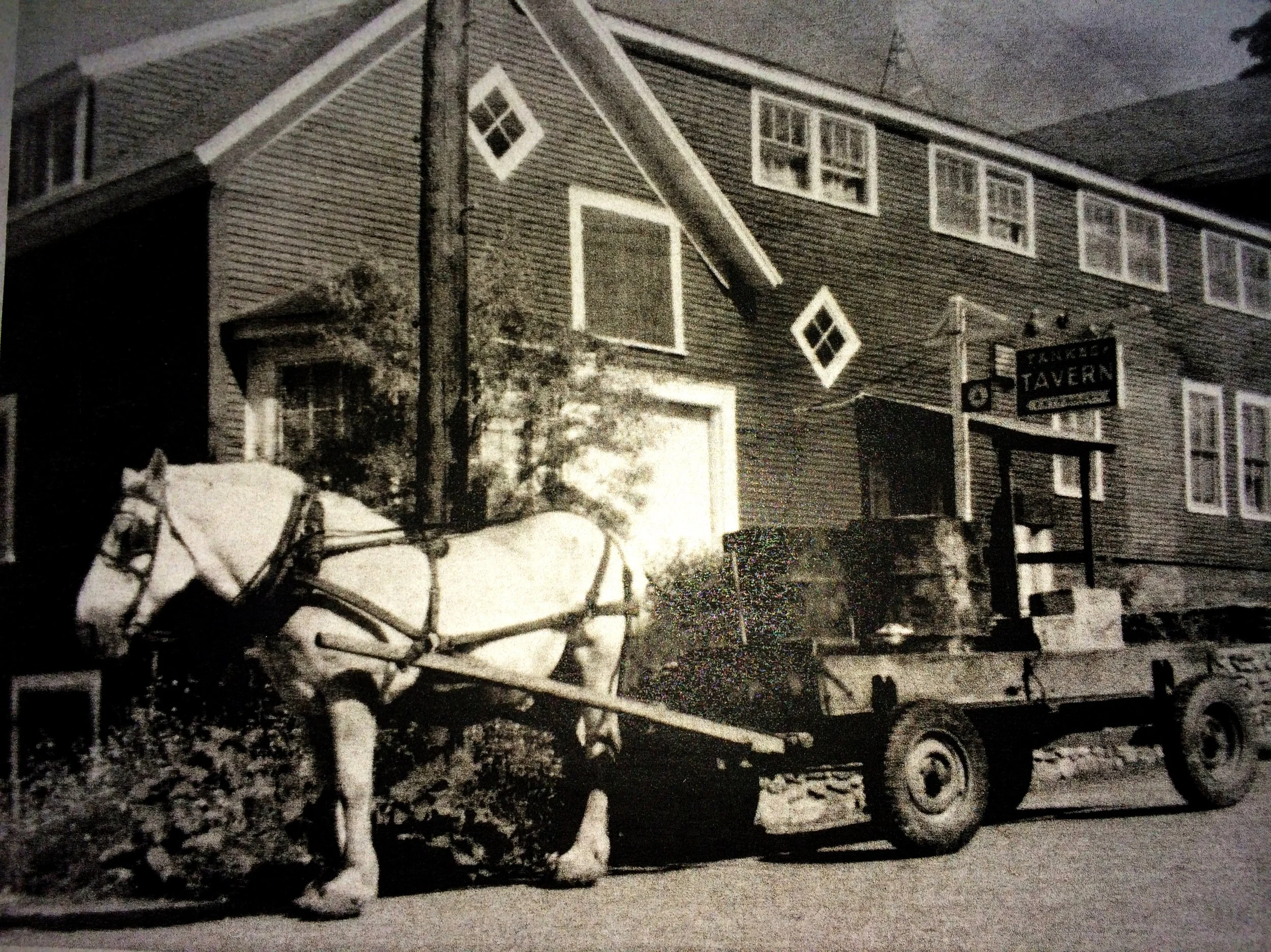 Historic photo of Butler House in Stowe Vermont with horse-drawn carriage outside the original building