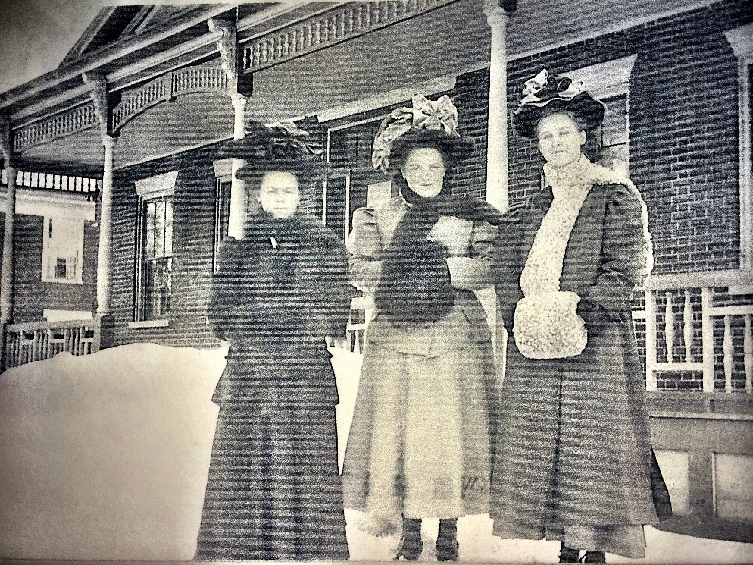 Vintage photo of Butler House of early residents outside Butler House reflecting Stowe Vermont's local history