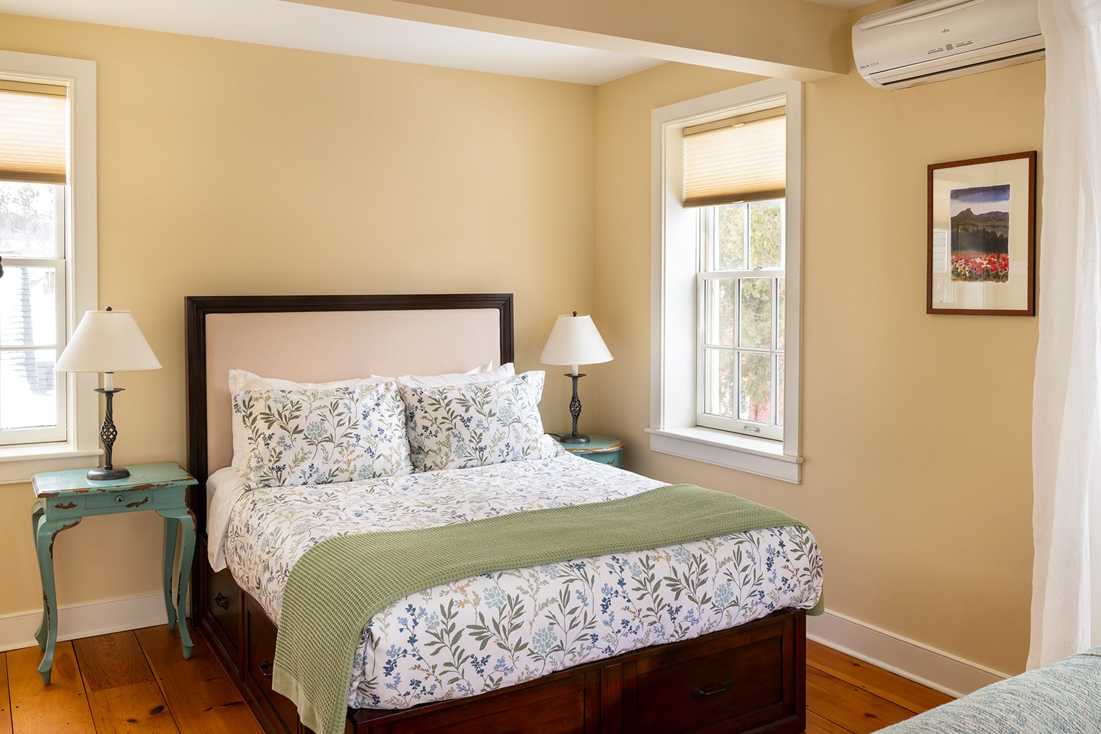 Queen bed with Sarah's Suite with wood floors, soft natural light and classic New England details