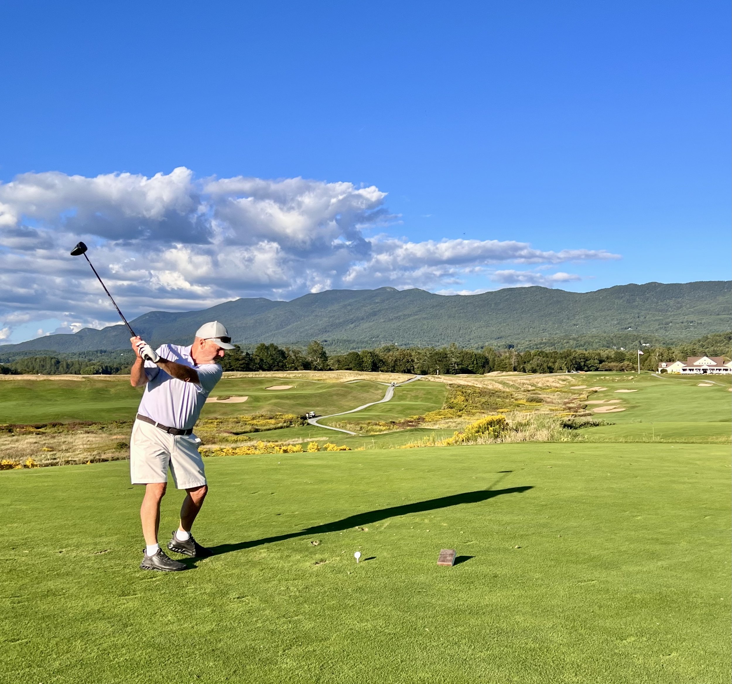 Golfing in Stowe Vermont with mountain views and scenic fairways in the Green Mountains