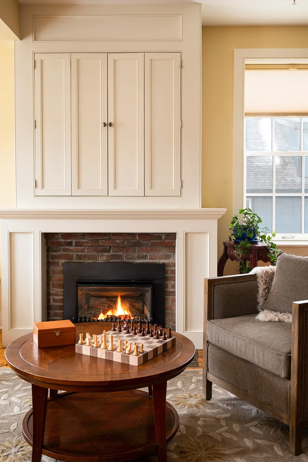 Original brick hearth with gas fireplace in Orion's Retreat highlighting historic character and cozy ambiance