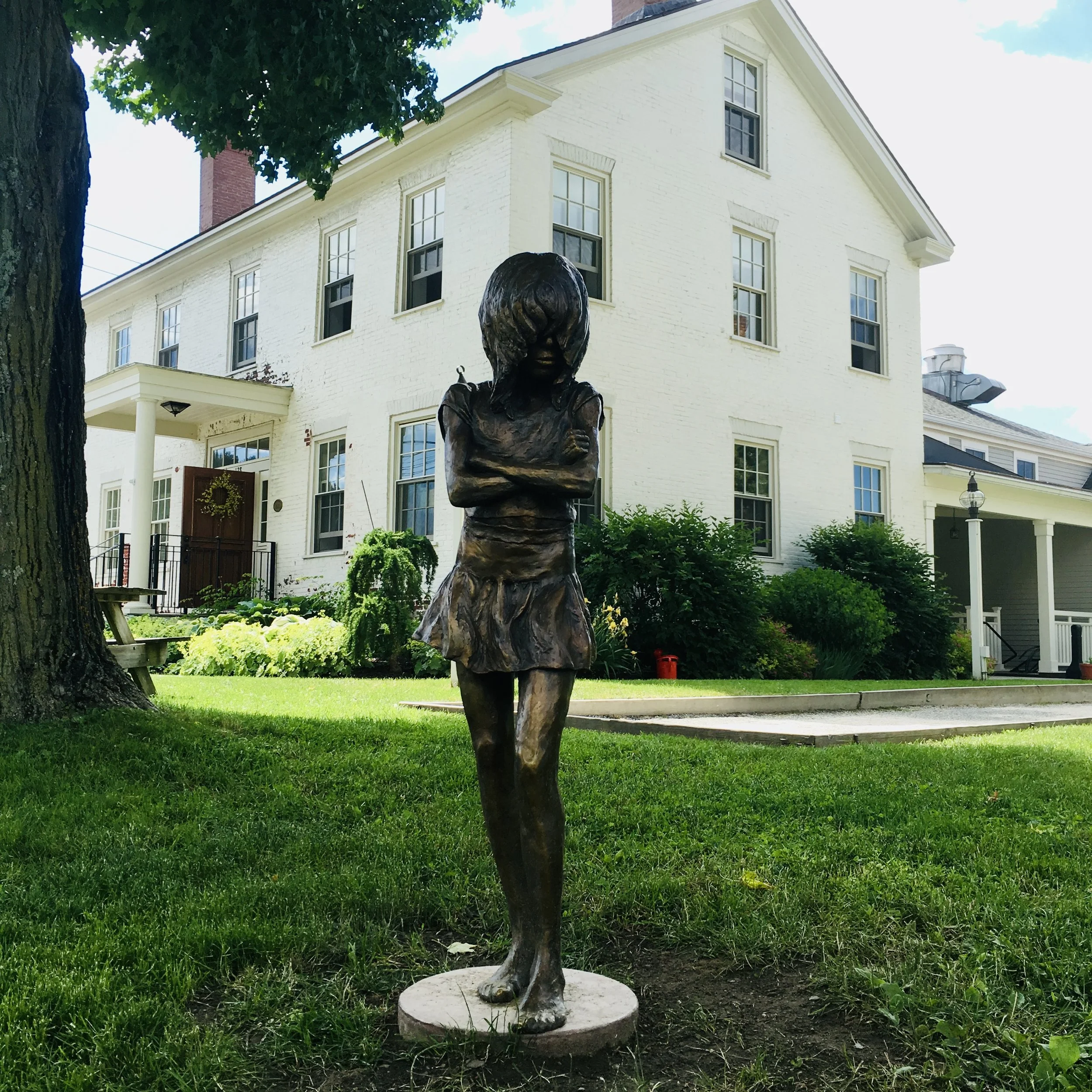 Outdoor Sculpture in front of historic Butler House Stowe representing local arts and culture scene