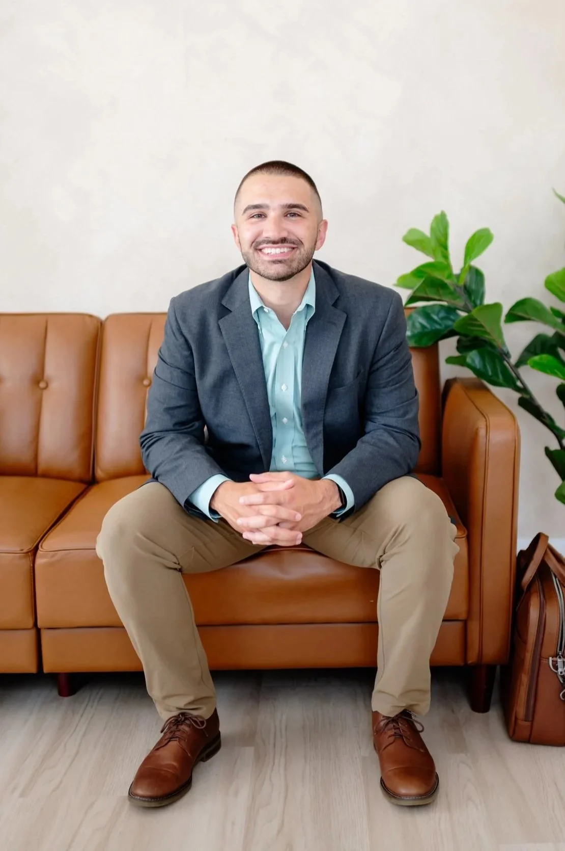 Matt Curtin CPA smiling on couch