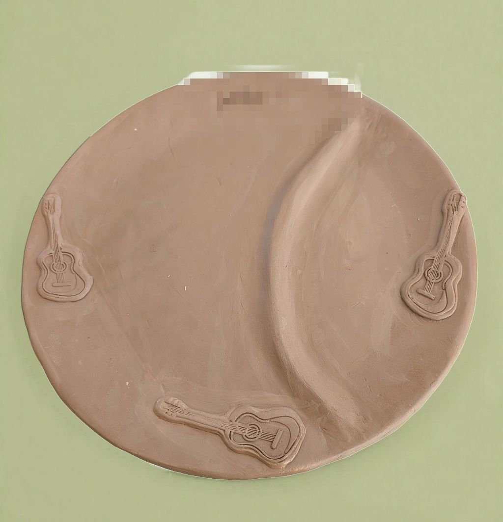 Just set this commission under plastic to start drying. Just in case the person who is to receive it as a gift might see it, I blurred the name stamped on this personalized plate. 

Fun detail; the back has musical instruments and notes stamped in it