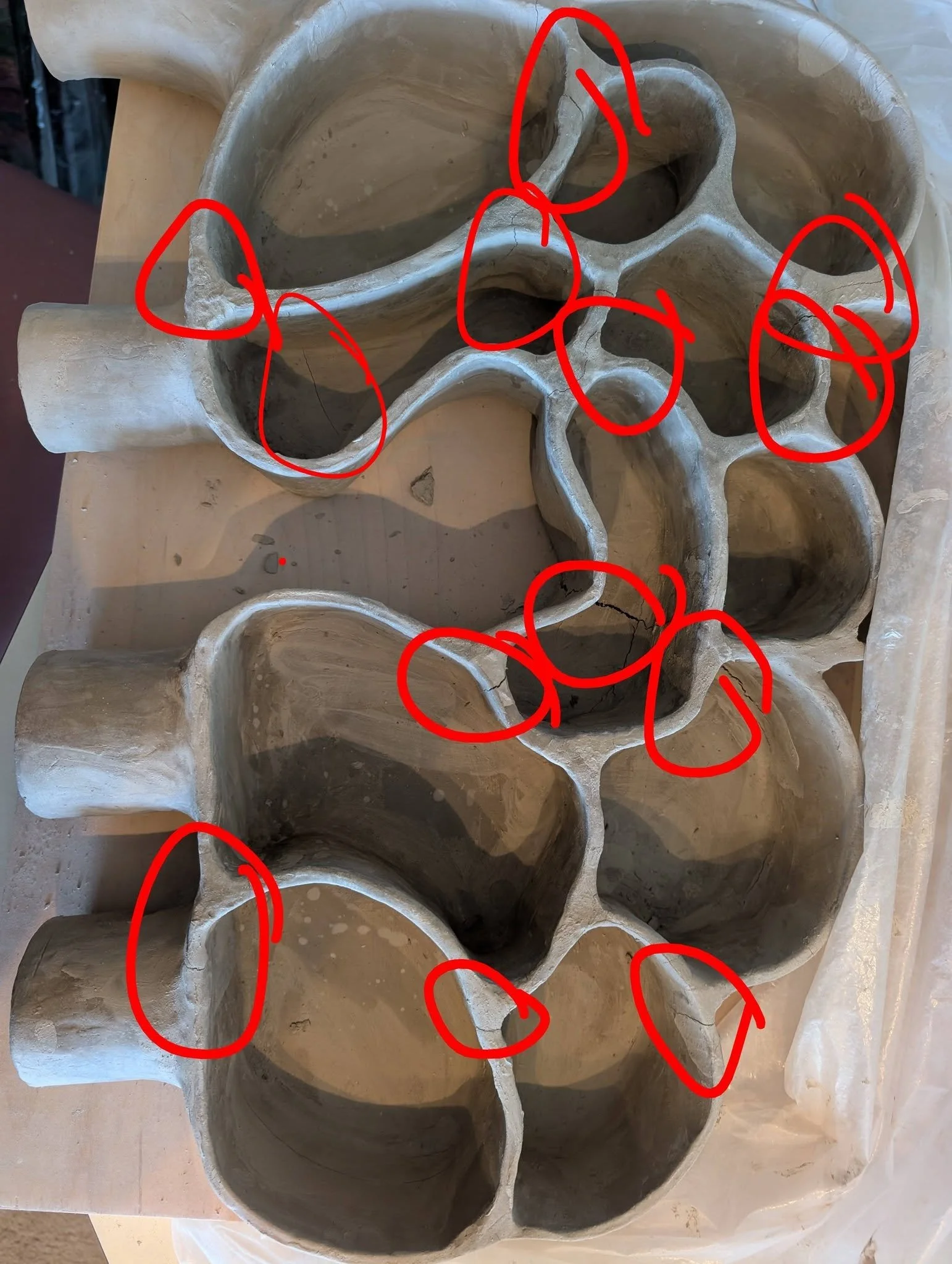 Ok, guys...

I'm giving up on repairing this. Those red circles are all structural cracks.

BUT I think I'm going to go with plan B.

Plan B is Fiddle Around and Find out. 

Can I bisque fire it? 

If so, can I then use epoxy on it? 

Can't hurt to t
