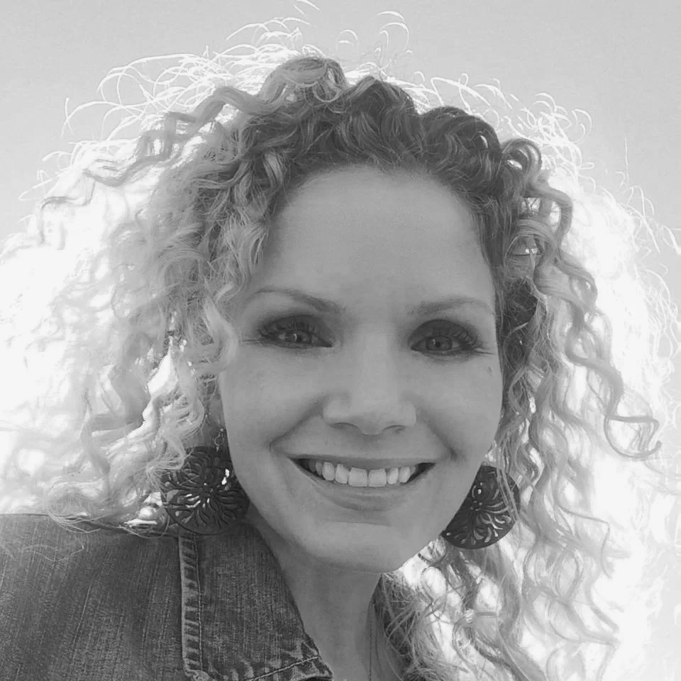 Black & white portfolio image of woman (Angela Hains) smiling