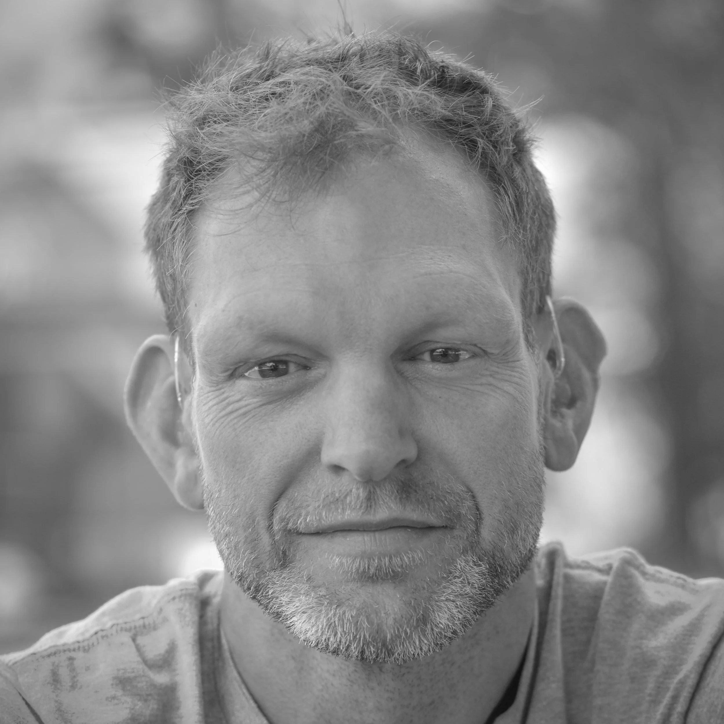 Black & white portfolio image of man (Adam White) smiling