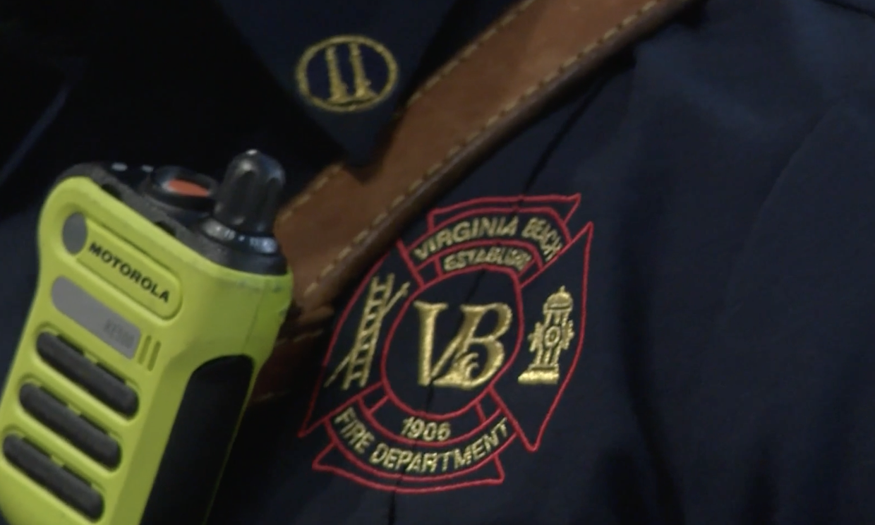 Close-up of a firefighter's uniform with an embroidered patch.
