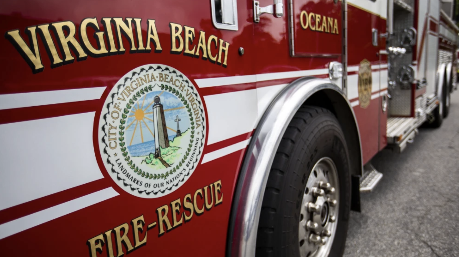 Close-up of a Virginian Beach fire-rescue fire truck showing the city seal and part of the vehicle.