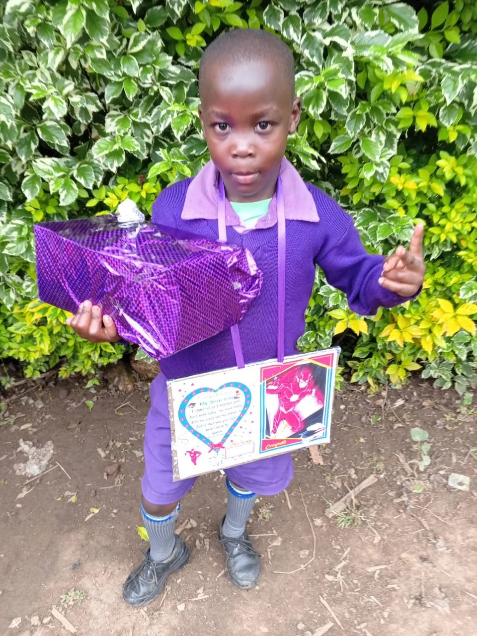 This is Elias Sore with his awards. He came first in his class.