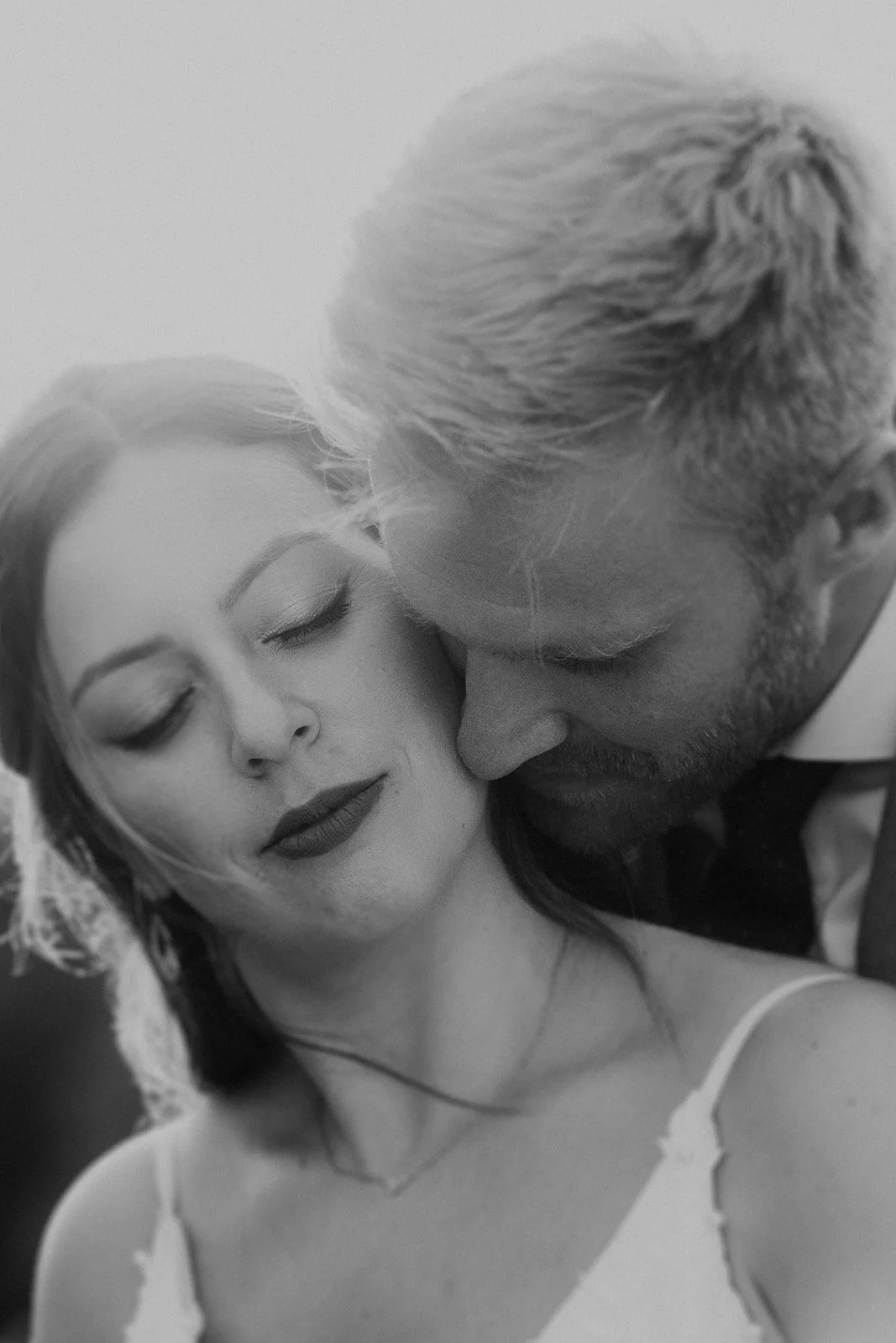 Close-up of bride and groom sharing an intimate and emotional moment