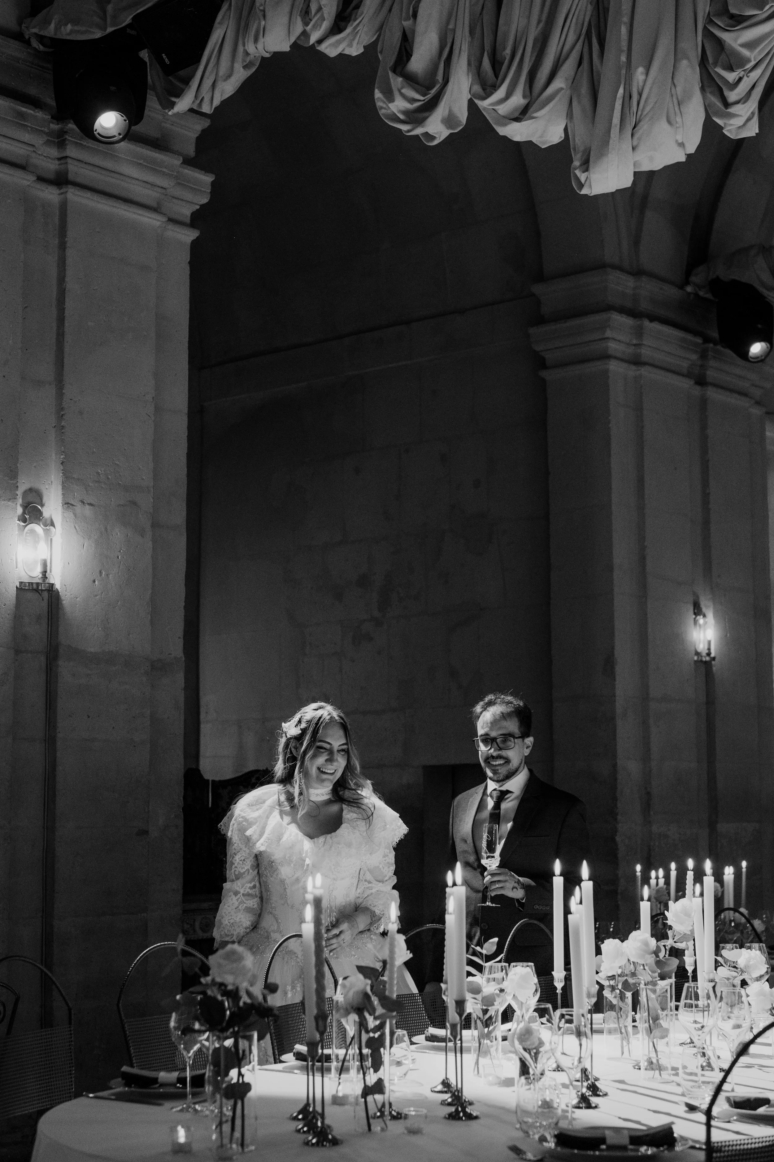 Bride and groom dancing together on the dance floor during a wedding celebration at night