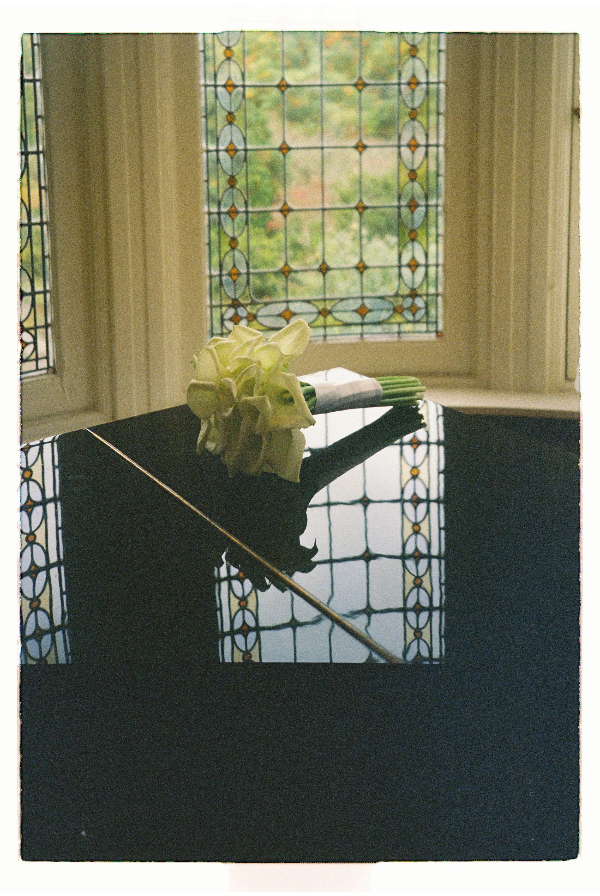 Soft natural light entering through a window creating an artistic interior wedding detail