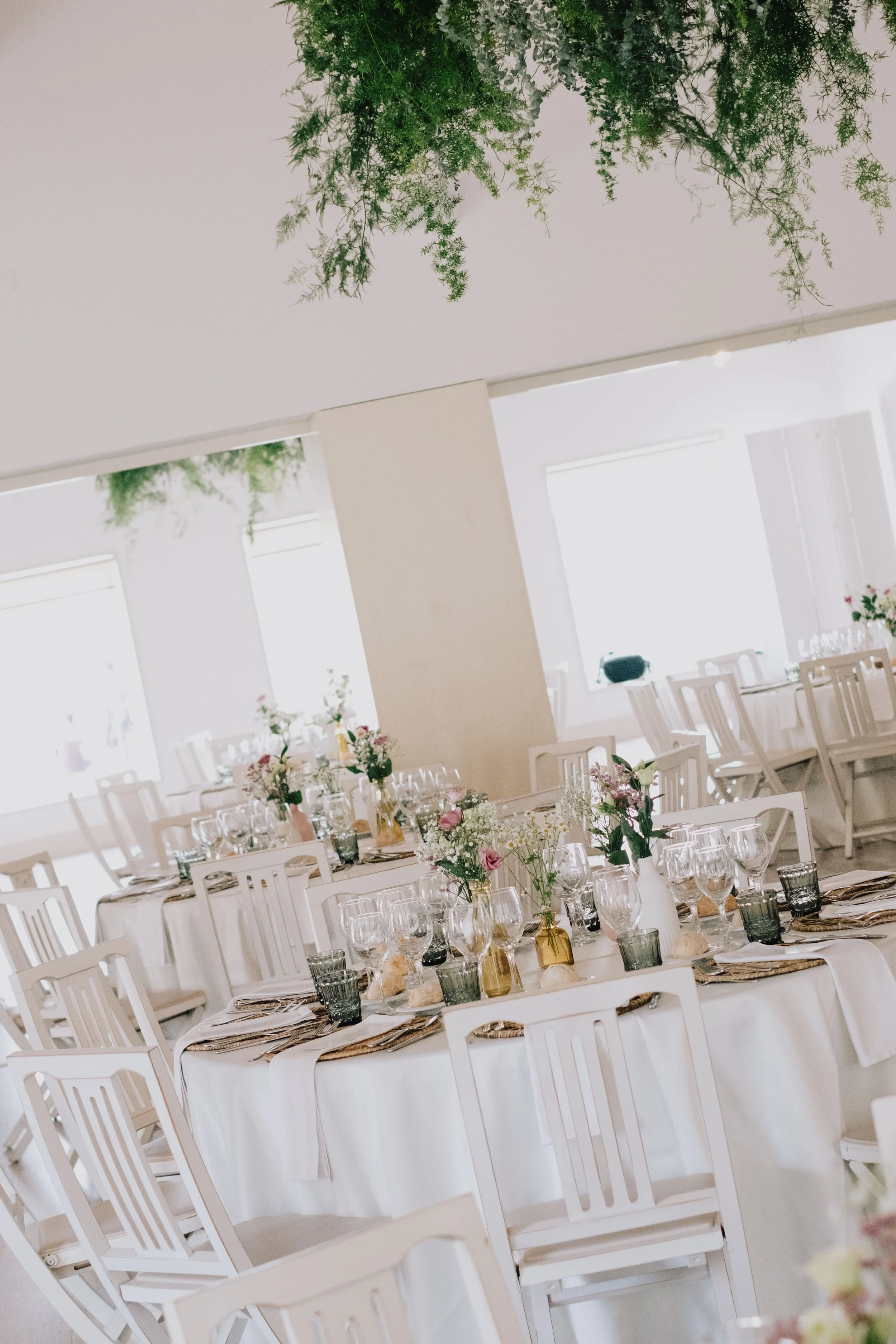 Elegant wedding reception interior with decorated tables and floral arrangements