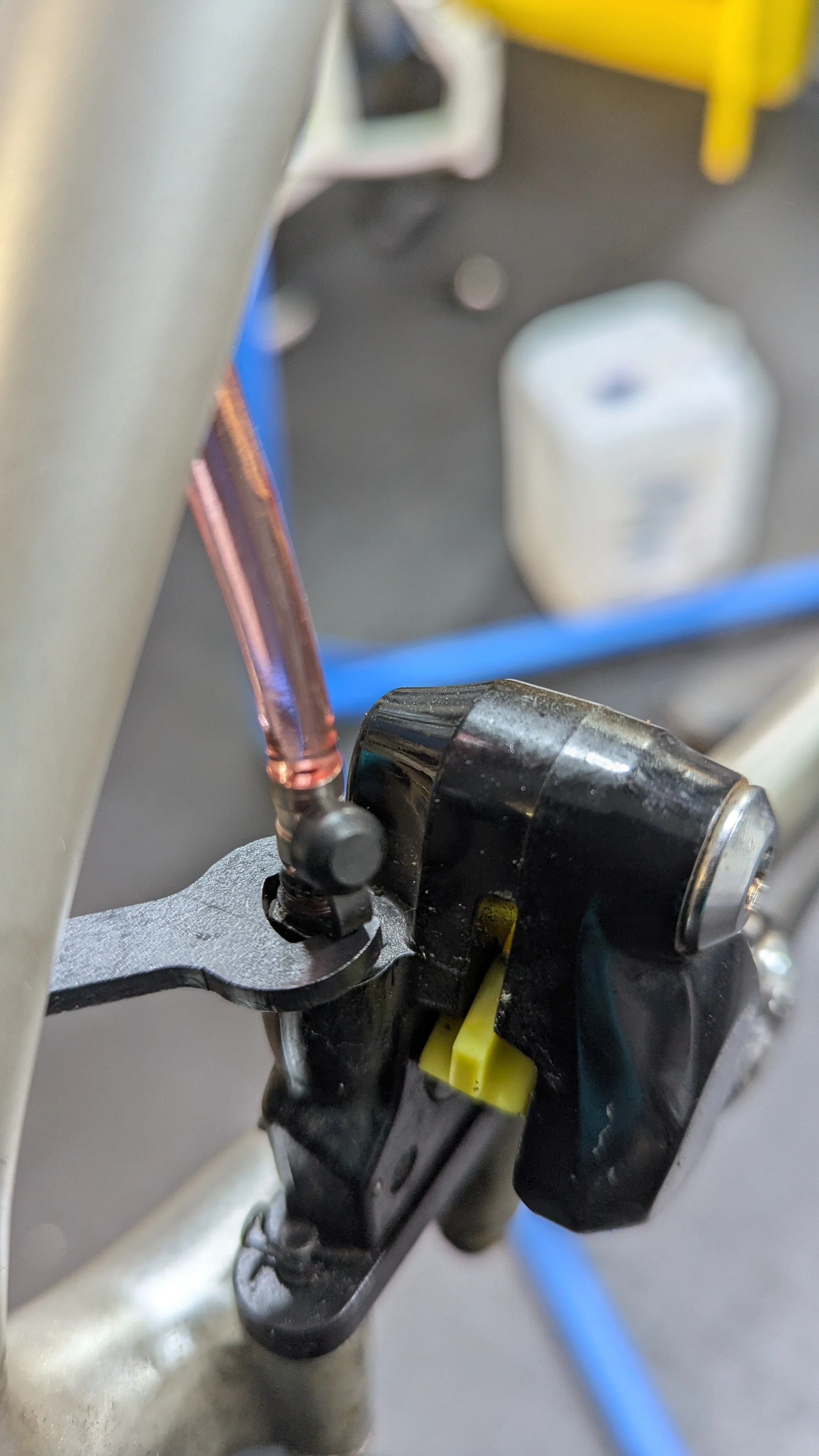 Opening the caliper port to bleed a hydraulic brake system