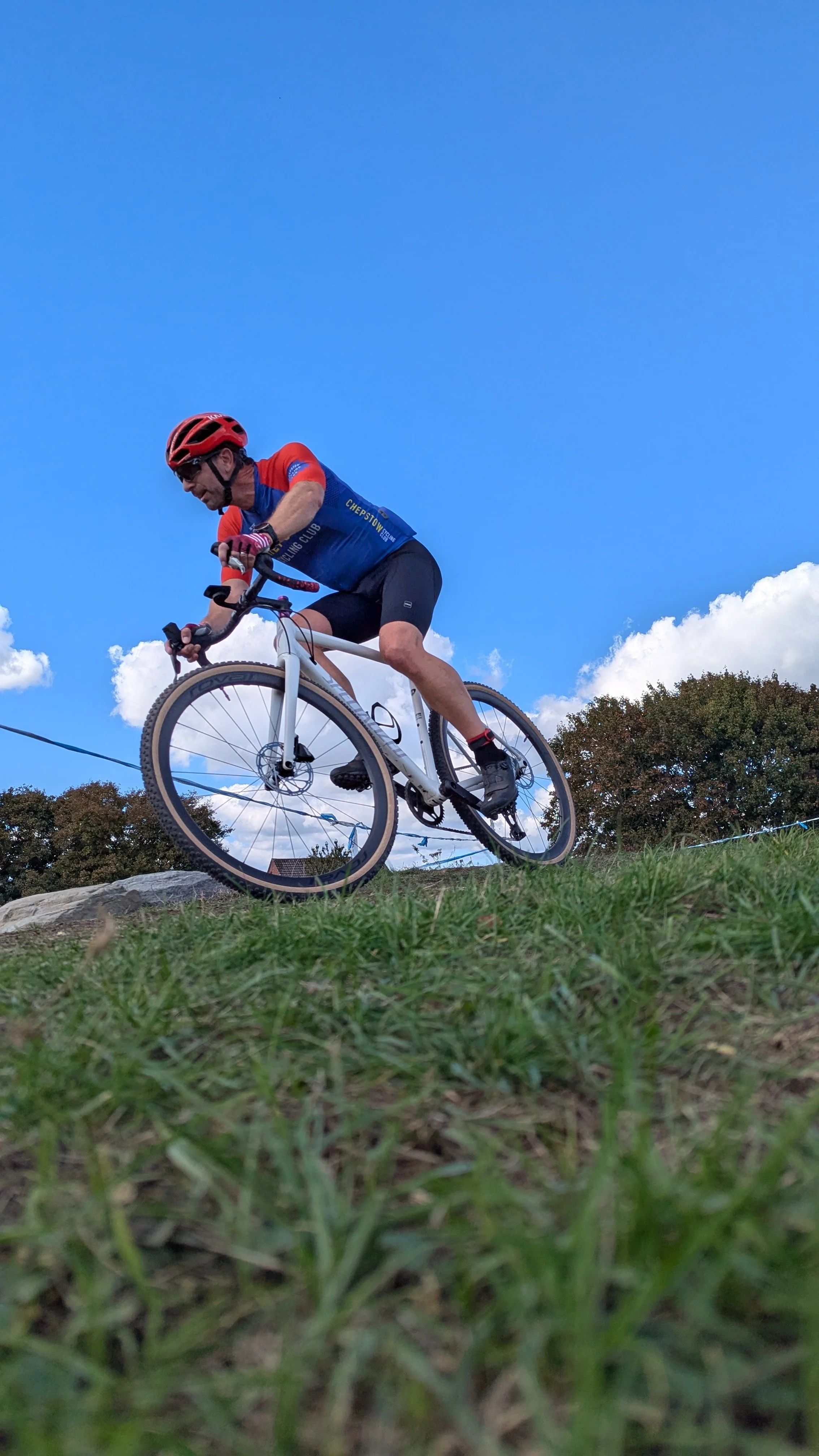 Cyclocross rider racing on grass