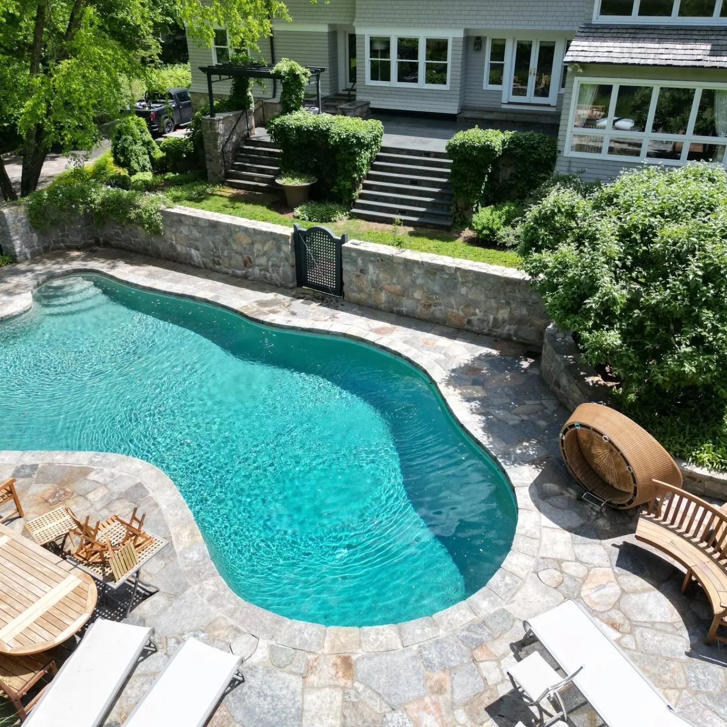 Poolside done in granite flagging  with raised terrace done in thermal bluestone 

#poolside
#fairfieldcounty
#masonry