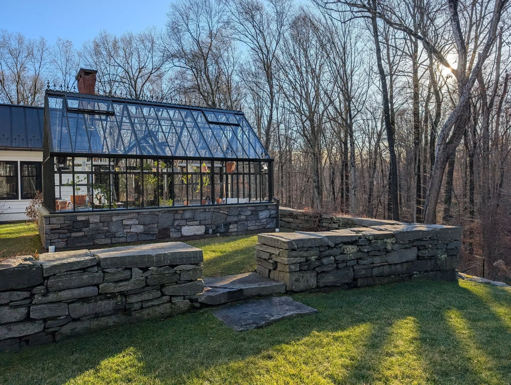 green house foundation veneered with weathered granite