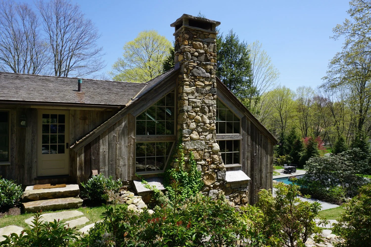 fieldstone chimney with raised bluestone cap