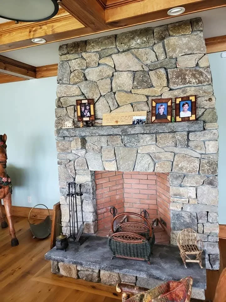 fieldstone and granite fireplace
