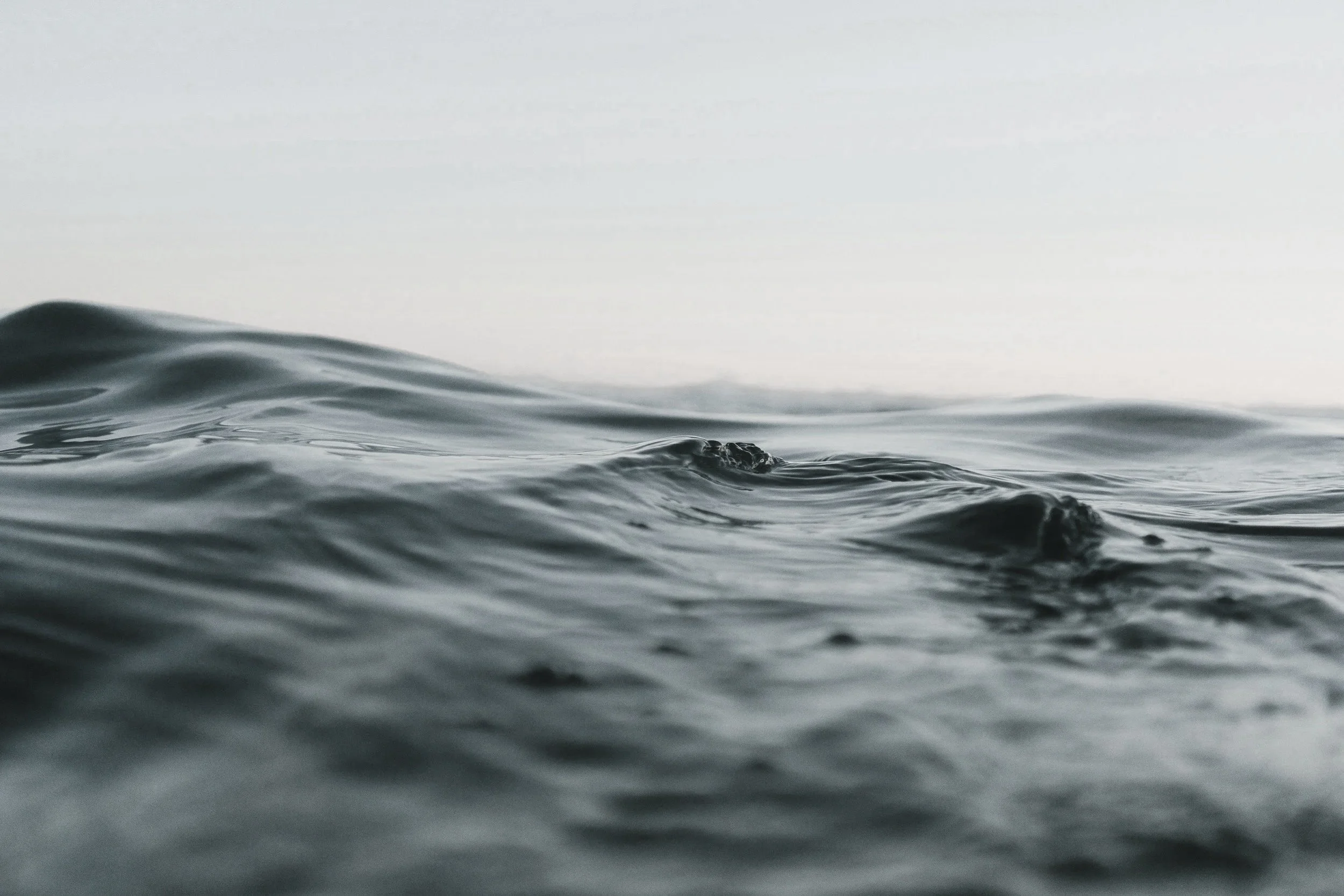 Close-up of ocean water with gentle waves on the surface.