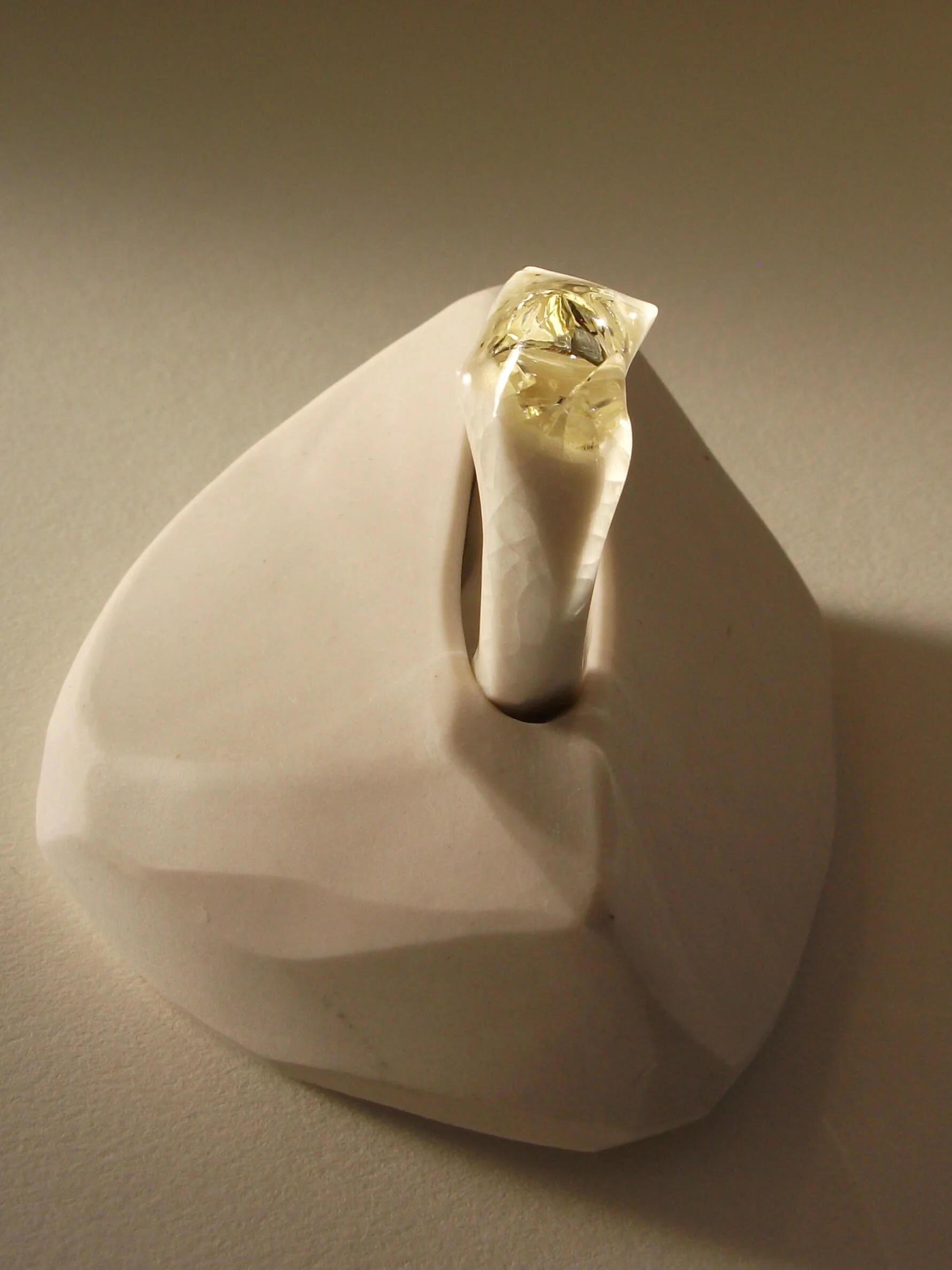 Bone-white porcelain ring with crackle surface and soft champagne glass jewel